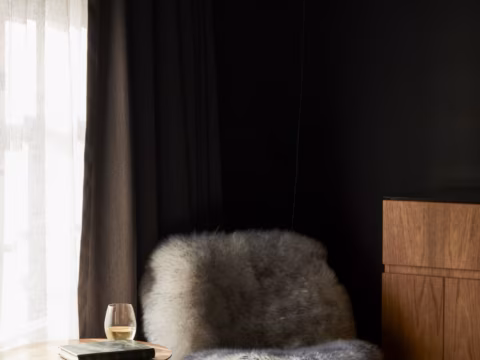 Quiet reading corner with Tasmanian light and natural textures at Wharfstone Hotel