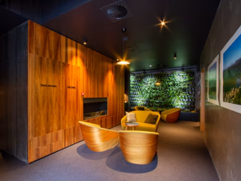 Foyer seating with timber panelling and living wall at Wharfstone Hotel